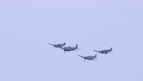 Aerobatic-flight-by-four-Blades-Aerobatic-Team-monoplanes-in-slow-motion-during-the-day