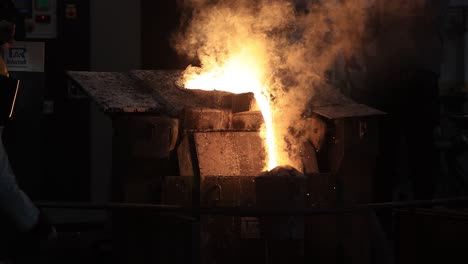 close-up-seen-iron-is-taken-out-of-the-furnace-and-prepared-for-the-moulds