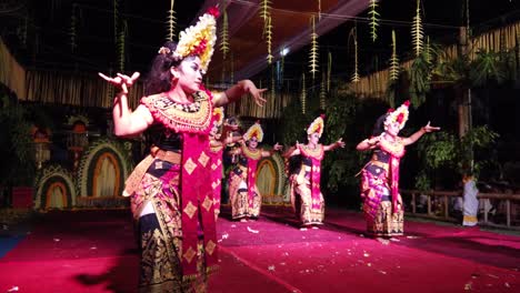 Balinese-Girls-Perform-Sisya-Jegeg-Dance-in-Bali-Temple-at-Night,-Beautiful-Women-Moving-in-Traditional-Costumes-of-Calonarang-Ritual,-Indonesia