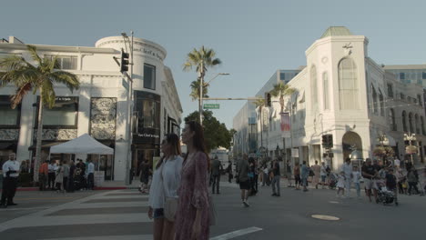People-walking,-shopping-and-sightseeing-on-the-famous-Rodeo-Drive-in-Beverly-Hills,-CA
