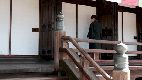 Japanese-lady-praying-at-a-shinto-shrine