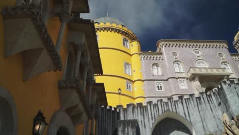 Moving-shot,-Scenic-view-of-Exterior-Design-in-Pena-National-Palace-in-Portugal,-Dark-Blue-Sky-in-the-background