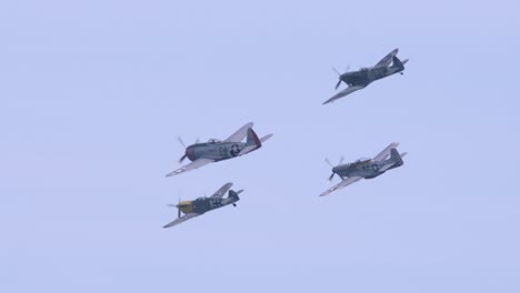 Four-mono-planes-performing-aerobatic-feats-in-slow-motion-in-the-sky