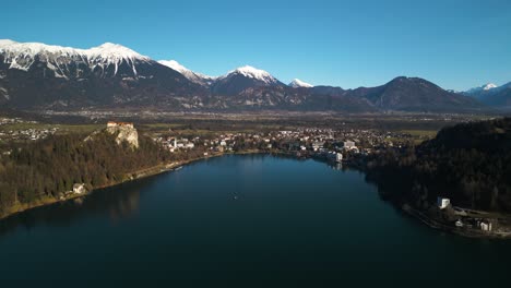 Drone-Flying-Towards-Downtown-Bled,-Slovenia