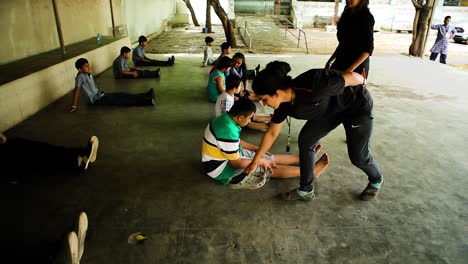 wide-shot-of-Many-mentally-retarded-children-are-doing-physical-exercises-which-are-being-trained-by-trainers,-Right-to-Education