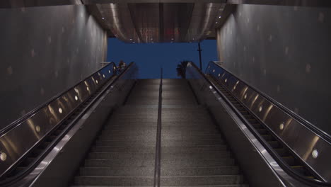 Upward-panning-slow-motion-shot-of-escalator-in-Hollywood-Blvd-subway-station
