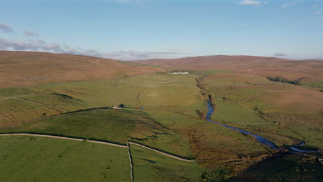 Establishing-Drone-Shot-of-Yorkshire-Dales-Landscape-with-Stream-and-Fields