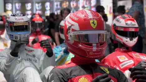 Mannequins-dressed-in-racing-suits-highlight-the-evolution-of-the-F1-sport-and-safety-through-time-during-the-world's-first-official-Formula-1-exhibition-at-the-IFEMA-Madrid-in-Spain