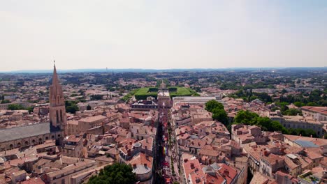 Aerial-view-of-Montpellier-city-with-the-main-street-filled-with-people-for-the-gaypride-parade