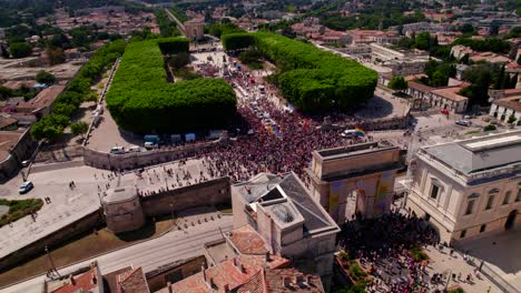 Aerial-establishing-shot-of-a-large-crowd-of-gay-pride-protesters-protesting