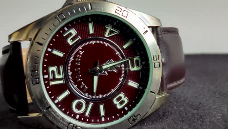 Close-up-of-a-Men's-leather-casual-wrist-watch,-having-dark-brown-belt-and-dial-and-stainless-steel-lug-frame