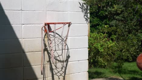 Hit-the-Ball-on-House-Basket-Hood,-Slow-Motion