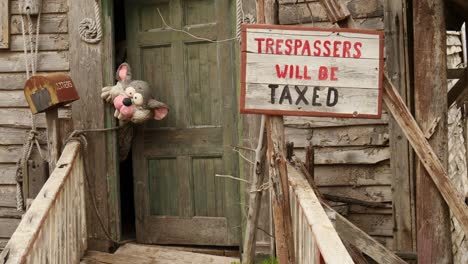 Trespassers-Will-Be-Taxed-Sign-In-Popeye-Village,-Malta