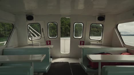 Inside-a-big-passanger-steel-boat-cruising-through-a-lake