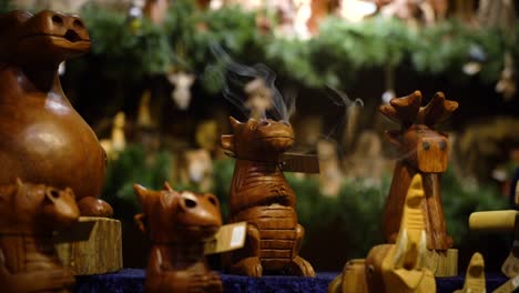 Close-view-of-the-wooden-dragons-that-produces-aroma-smoke-from-aroma-sticks