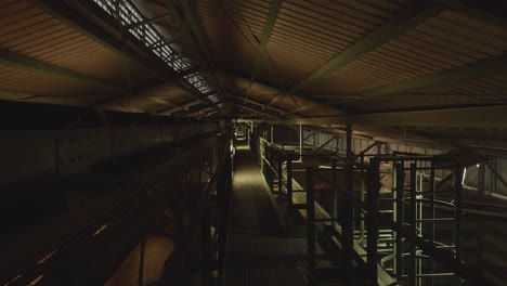 Inside-View-Of-Wheat-Silo-Factory-Near-Ceiling-Looking-Down-Walkway