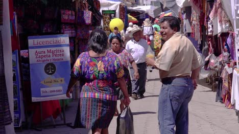 Indigenous-people-walking-through-the-Chichi-market-in-Guatemala