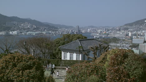 Overlooking-Nagasaki-with-people-in-foreground,-Japan