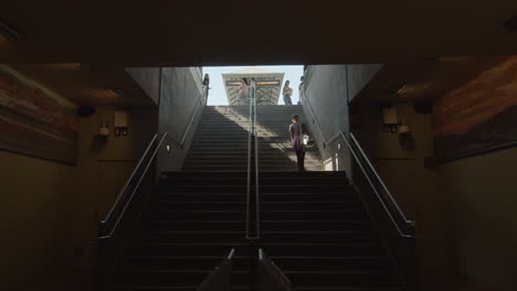 Slow-motion-shot-of-woman-walking-up-the-stairs-ini-Downtown-Los-Angeles'-historic-Union-Station