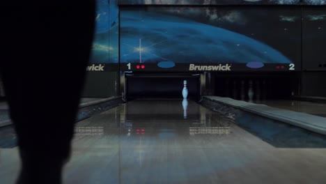Girl-hitting-spare-in-bowling-alley
