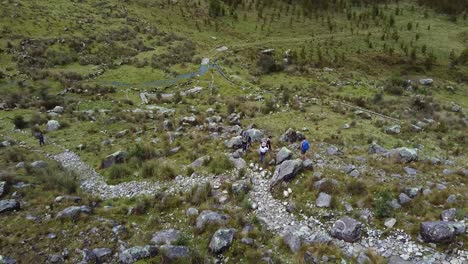 A-Group-Of-Hikers-On-A-Rocky-Terrain-In-Huaraz-Trekking-In-Peru
