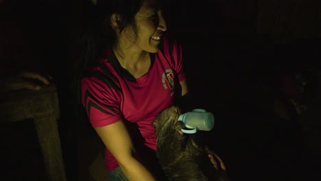 Woman-Feeding-With-Milk-Bottle-Unique-Species-Of-Baby-Nutria-Rodent