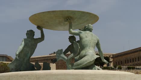 Close-Up,-Low-Angle-Shot-Of-The-Triton-Fountain-By-The-City-Gate-Of-Valletta