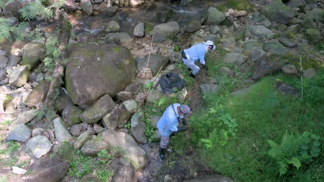 Government-workers-clean-a-river-during-the-Chung-Yeung-Festival