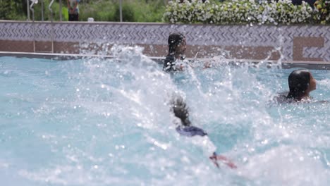 Asian-Kids-Splashing-in-Swimming-Pool