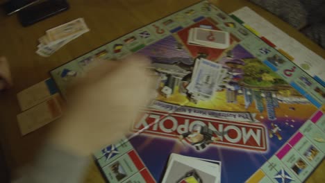 A-roll-dice-during-a-game-of-Monopoly