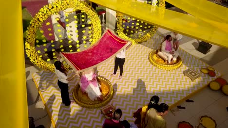 A-drone-shot-of-a-bride-to-be-at-her-haldi-ceremony-at-Kenilworth-resort-in-South-Goa,-India