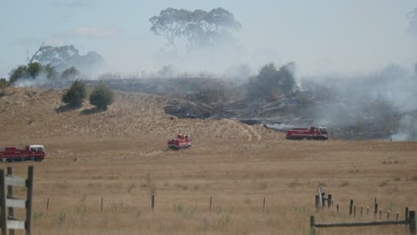 Fire-engines-trucks-approaching-grass-fire-area-to-control-spread