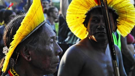 Indigenous-people-march-in-a-protest-against-destruction-the-indigenous-land,-Side-profile,-Close-up