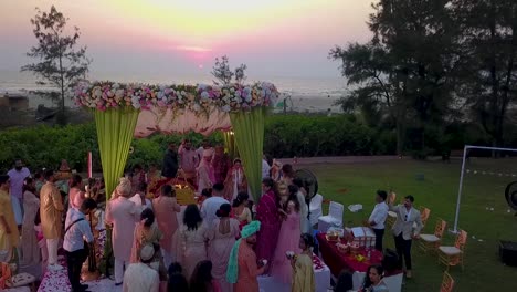 A-drone-view-of-bride-and-groom-at-mandap-at-Kenilworth-resort-in-South-Goa,-India