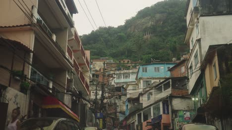 Pov-slow-motion:-Uphill-street-in-Rocinha-Favela-Neighborhood-in-Rio-de-Janeiro