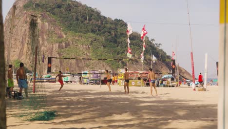 Young-Brazilians-play-beach-volleyball-at-Ipanema-Beach,-Rio-De-Janeiro,-Brazil