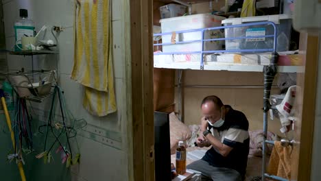 A-low-income-tenant-lives-in-a-cubicle-room-flat-as-he-shares-an-apartment-with-other-renters