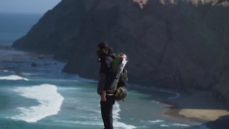 Shot-Of-Person-Walking-On-High-Summit-In-Beautiful-Seascape-Landscape,-Peru