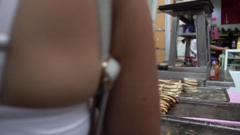 Colombian-chefs-making-traditional-breads-in-the-kitchen-of-street-stall-in-slow-motion