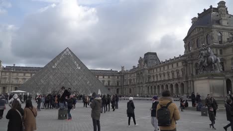 Tourist-exploring-Louvre-museum.-Tourist-exploring-Louvre-museum