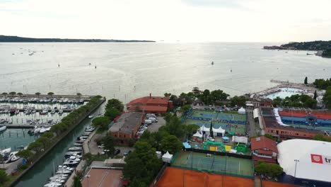 Drone-aerial-forward-flying-towards-Adriatic-sea-from-Portoroz---ATP-Challenger-Slovenia-Open-tennis-grounds