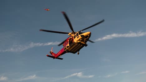 Rescue-Helicopter-hoovering-on-mission,-golden-hour-in-Los-Angeles,-USA