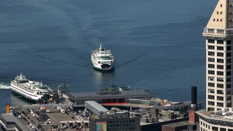 Drone-shot-of-the-Seattle-Ferry-Terminal-with-Smith-Tower-in-the-foreground
