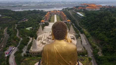 Drone-aerial-forward-flying-view-of-Fo-Guang-Shan-golden-Buddha-statue-Museum-complex