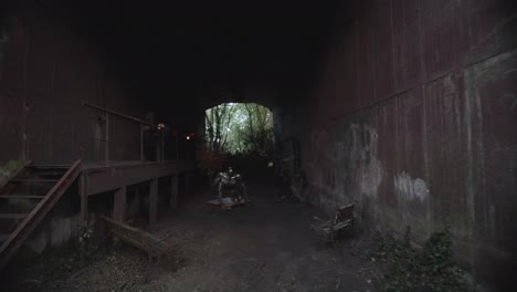 Tilt-Down-Follow-Shot-Inside-Abandoned-Building-At-The-Black-Earth-Park-In-Nyoiseau-With-Art-Installation