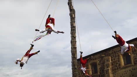 Voladores-de-Papantla-performing-a-ritual-dance-in-Tequila-town,-Jalisco,-Mexico---Medium-shot