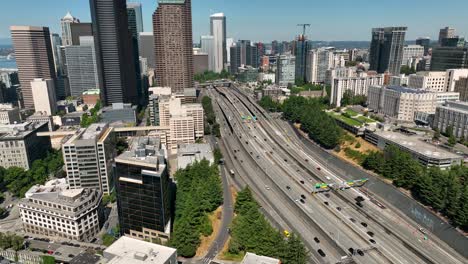 Drone-shot-of-cars-driving-into-Seattle-on-the-main-freeway