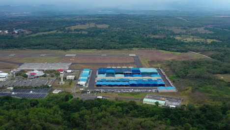 Aerial,-orbit,-drone-shot-around-a-small-airport,-near-Santo-Domingo,-Dominican-Republic