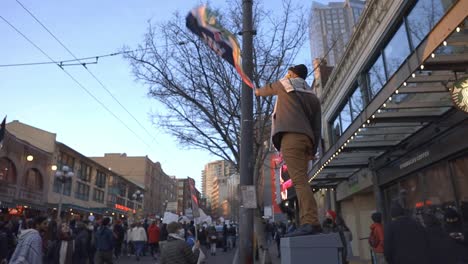 man-waving-flag-at-free-palastine-protest