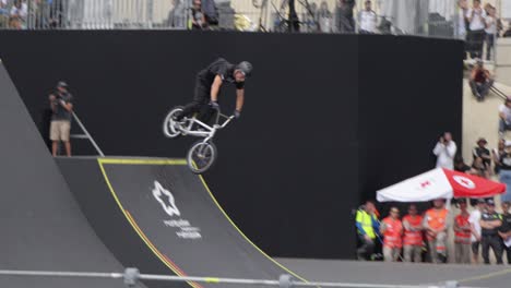 BMX-rider-performs-a-few-tricks-in-the-air-during-a-free-ride